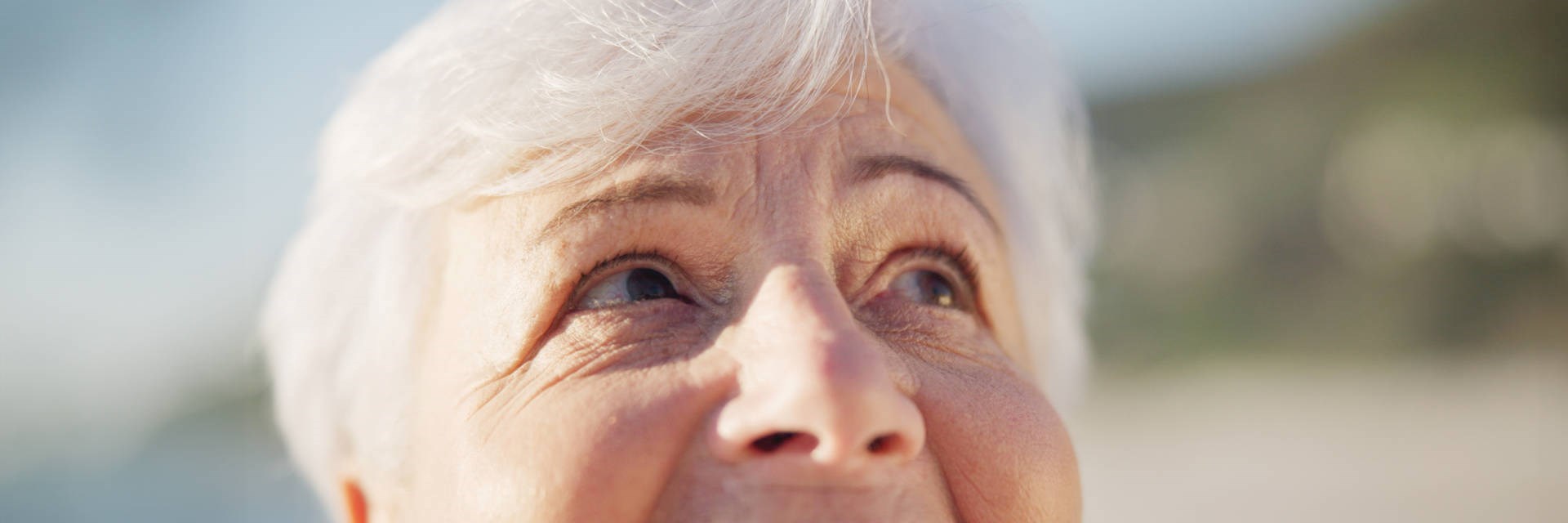 Close-up of older lady looking upwards