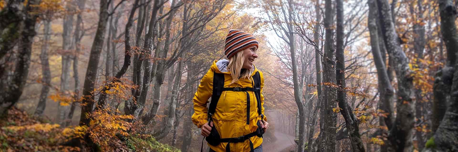 Woman hiking through the woods
