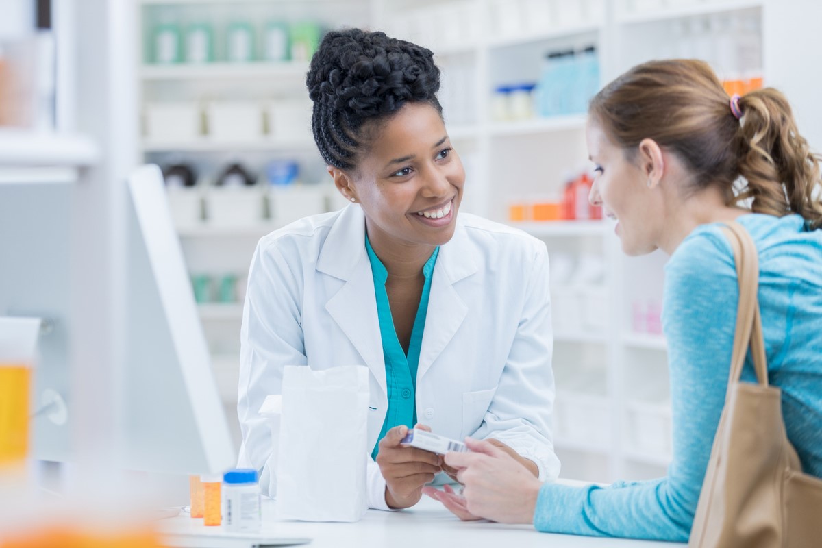 Woman consulting pharmacist