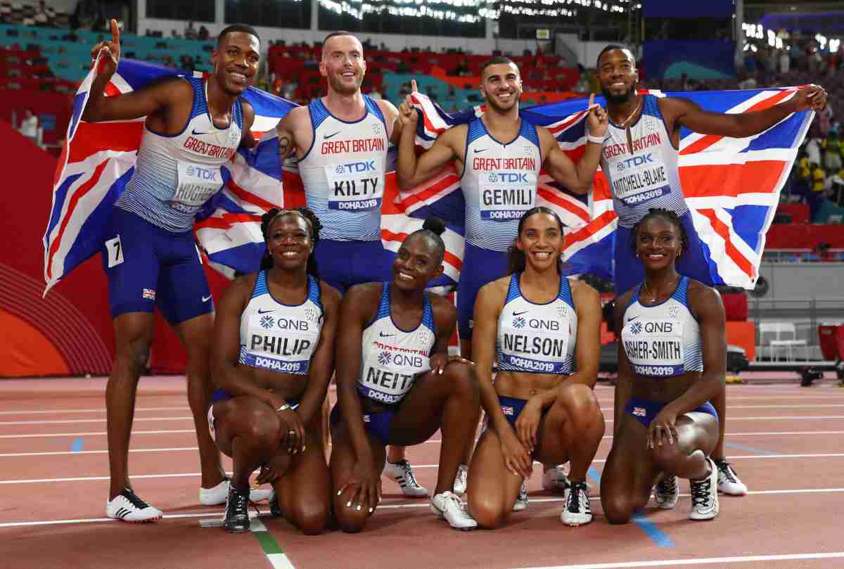 British athletes celebrating and holding UK flag