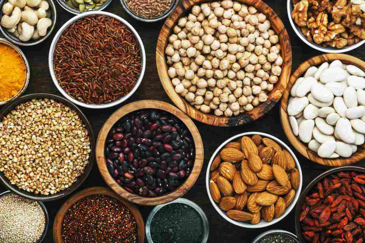 Beans and lentils in wooden bowls