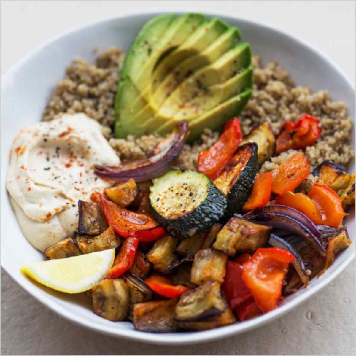 Roasted vegetables and avocado in a bowl